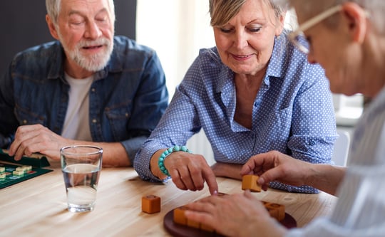 group-of-senior-people-playing-board-games-in-community-center-club